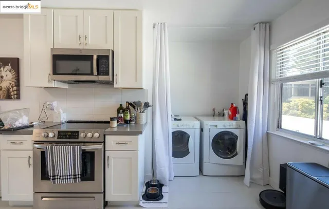 a kitchen with a stove and a microwave