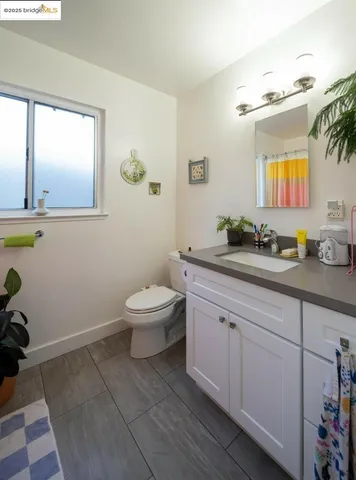 a spacious bathroom with a double vanity sink and a mirror