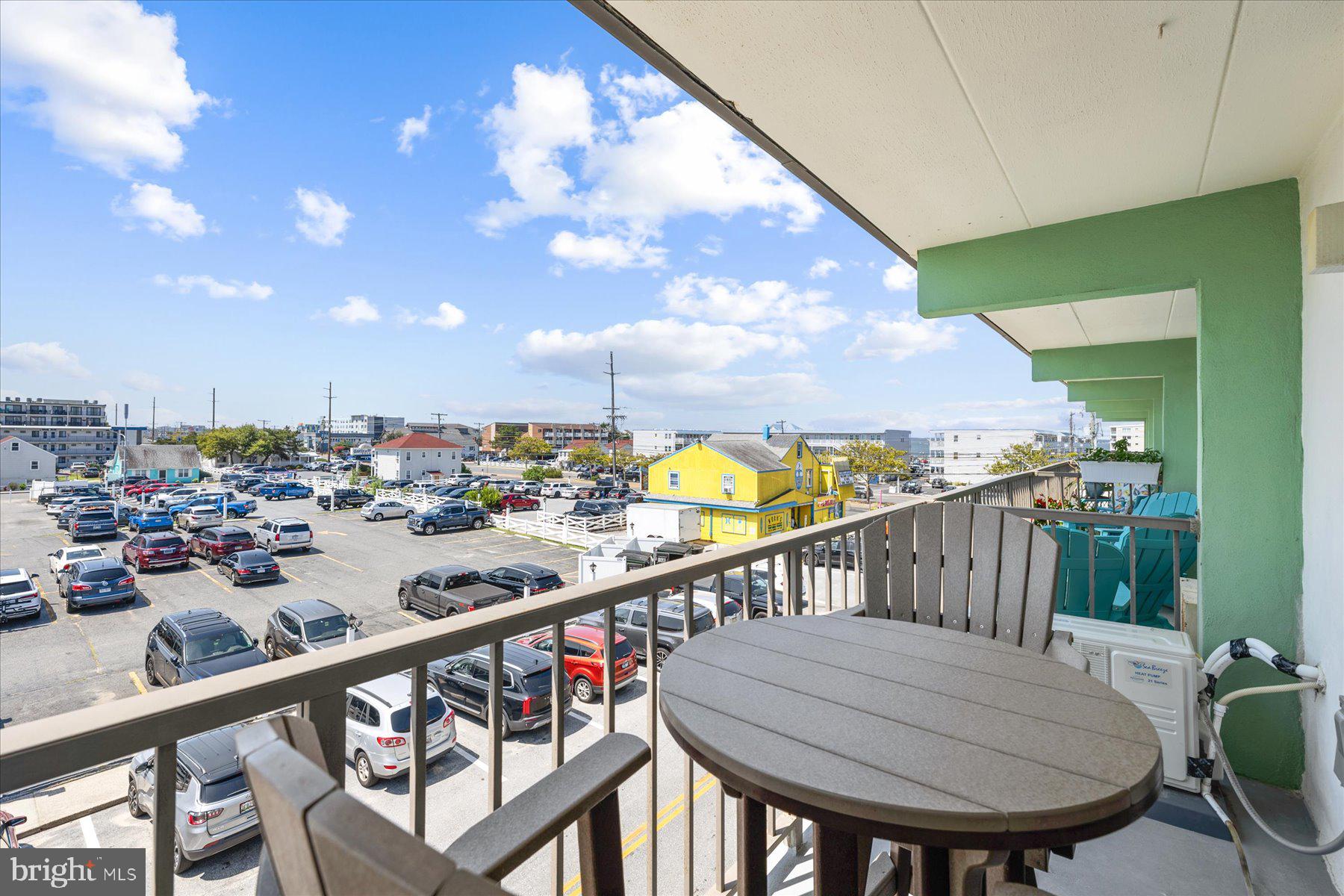 14 38th Street, Unit 301 Ocean City, MD 21842 - Photo 17 of 20 a view of a balcony dining table and chairs