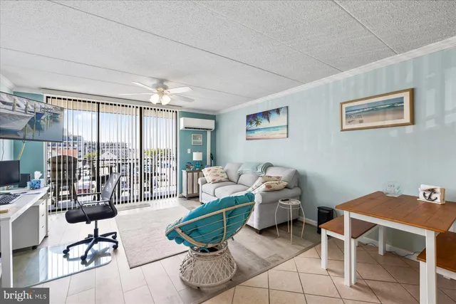 a living room with furniture and a floor to ceiling window