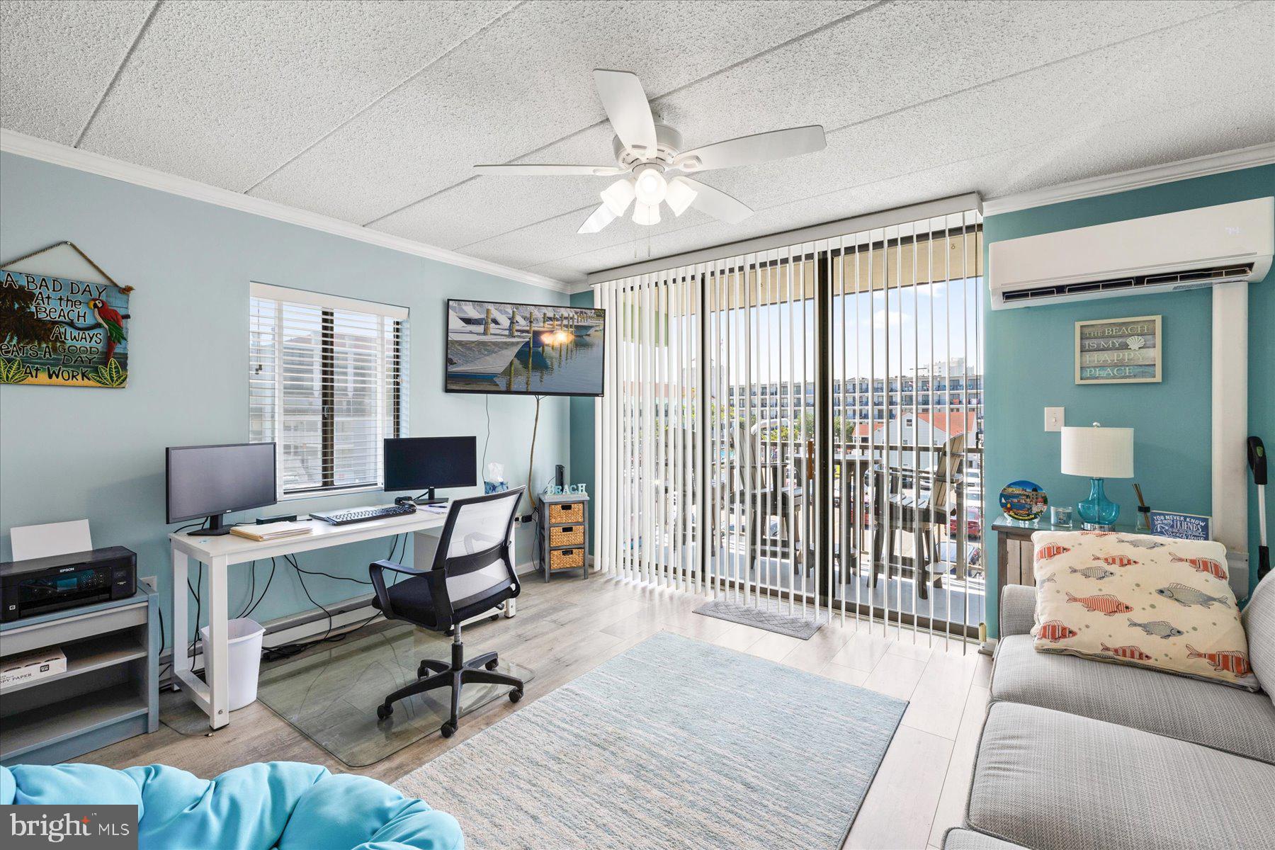 14 38th Street, Unit 301 Ocean City, MD 21842 - Photo 5 of 20 a view of a livingroom with workspace and a couch