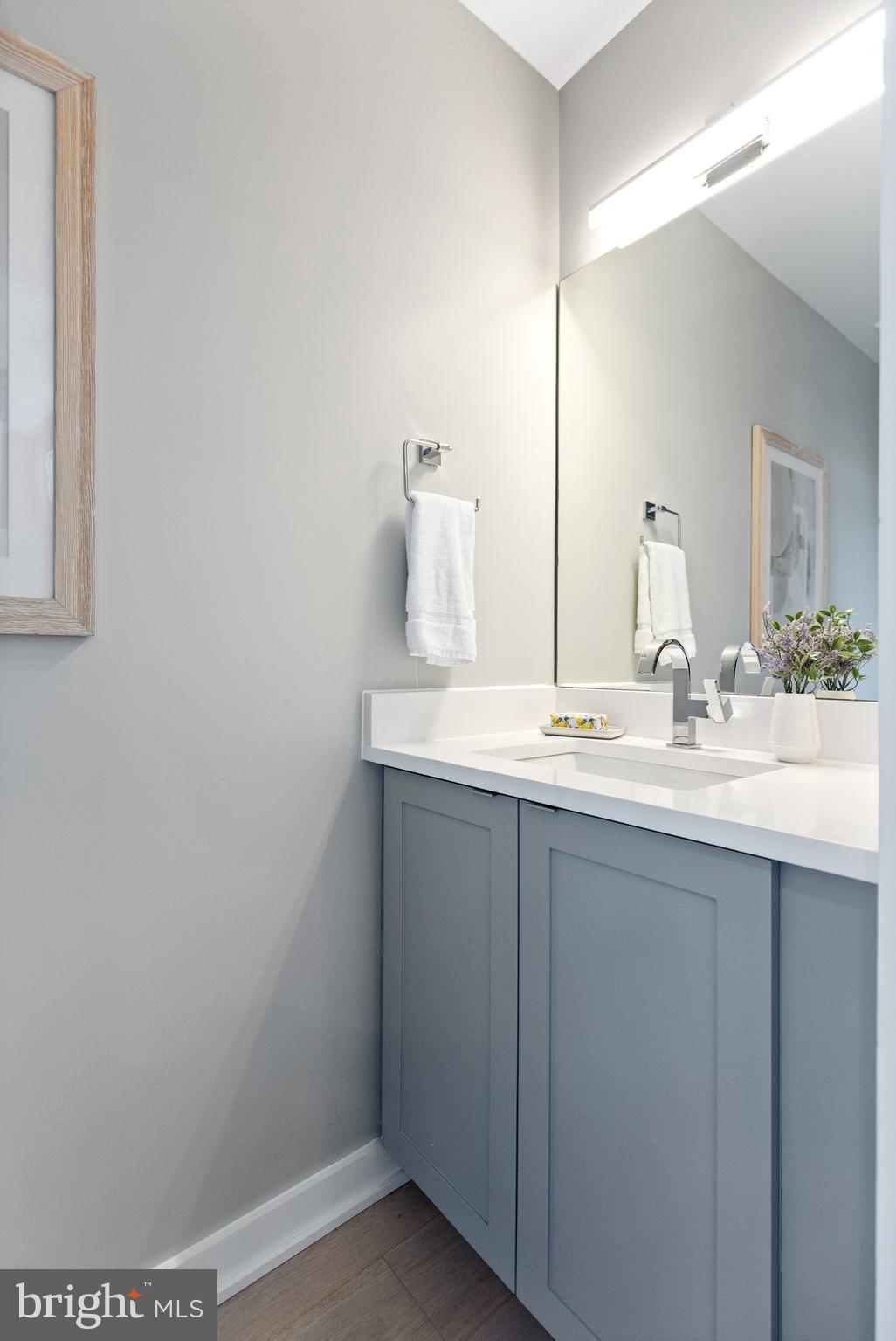 406 D Street Southeast Washington, DC 20003 - Photo 12 of 39 a bathroom with a sink and a mirror