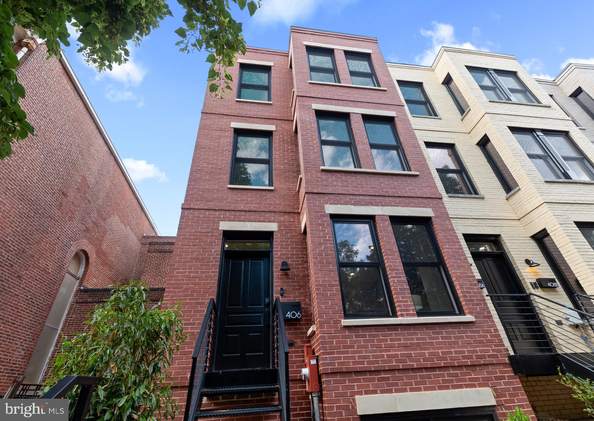406 D Street Southeast Washington, DC 20003 - Photo 2 of 39 a front view of a multi story building with windows