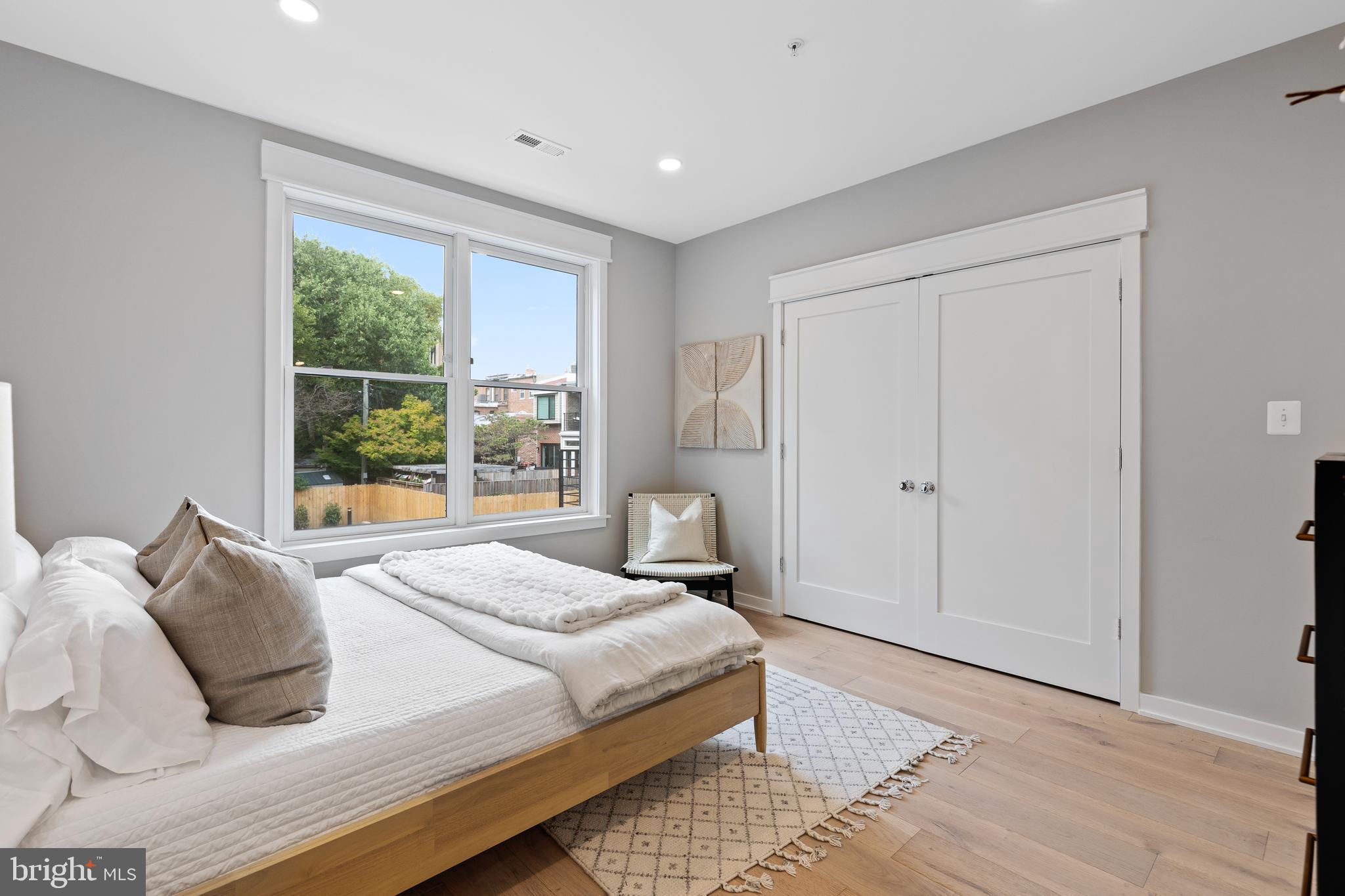 406 D Street Southeast Washington, DC 20003 - Photo 22 of 39 a bedroom with a large bed and a window