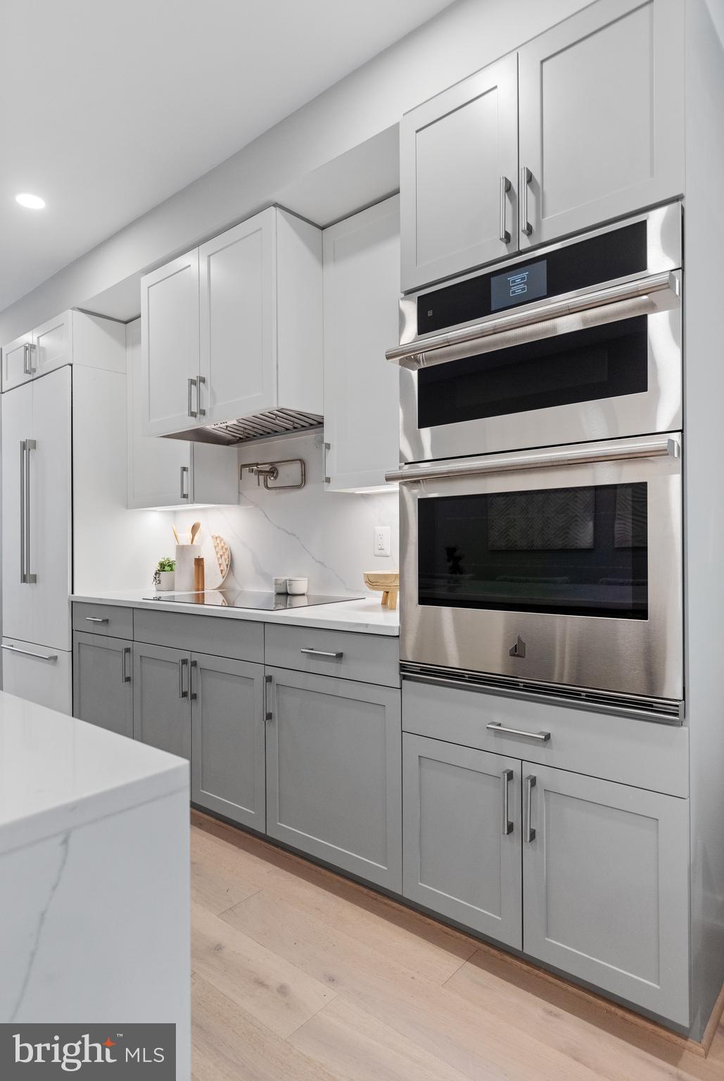 406 D Street Southeast Washington, DC 20003 - Photo 10 of 39 a kitchen with cabinets stainless steel appliances and sink