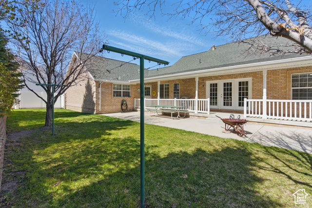151 South Haulage Road Eureka, UT 84628 - Photo 30 of 36 Rear view of house featuring a patio, french doors, and brick siding