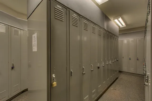 a bathroom with a shower and a glass door