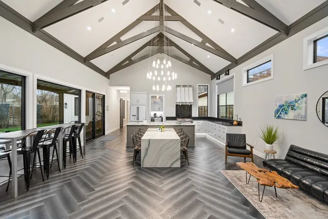 a living room with lots of furniture and white walls