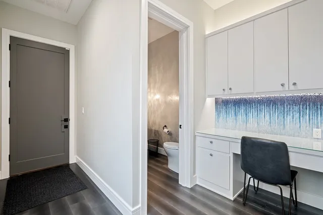 a view of kitchen with wooden floor and chair