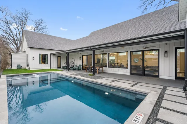 a view of a dinning room with swimming pool table and chairs