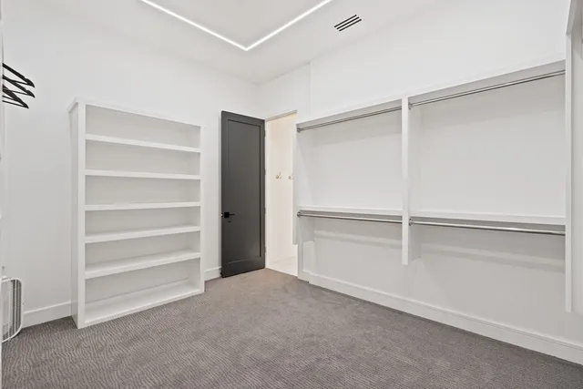 a view of an empty walk in closet
