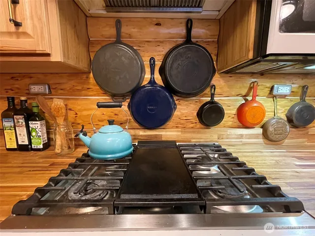 a stove top oven sitting inside of a kitchen