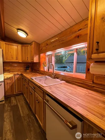 a kitchen with lots of counter space and appliances