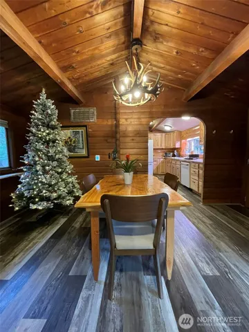 a view of a porch with furniture and a yard