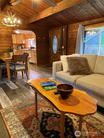 a living room with furniture and a table