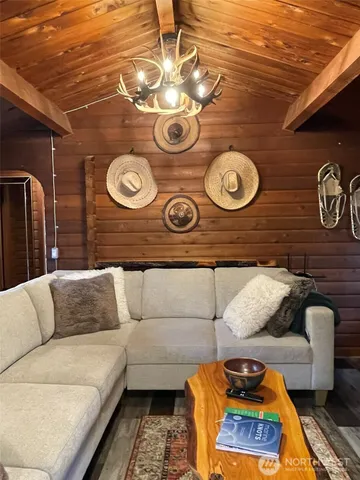 a living room with furniture and a rug