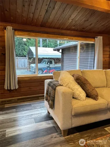 a bedroom with furniture and a large window