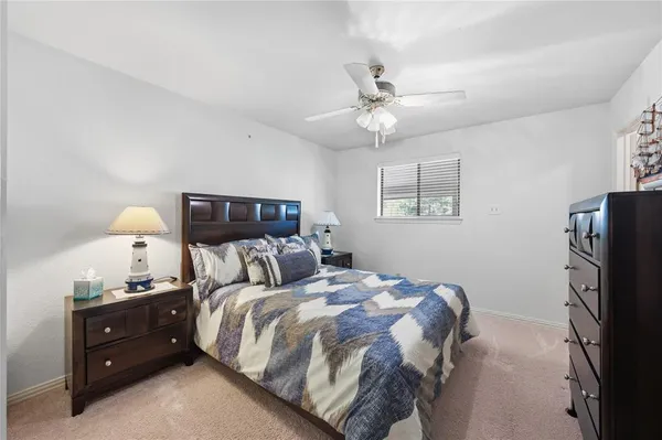 a bedroom with double bed and a window