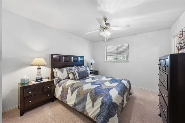 a bedroom with double bed and a window