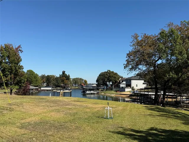 a swimming pool with outdoor seating and yard