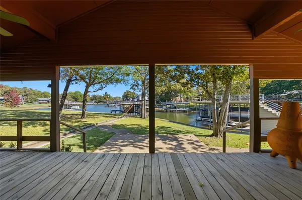 a view of a deck with wooden floor and outdoor space