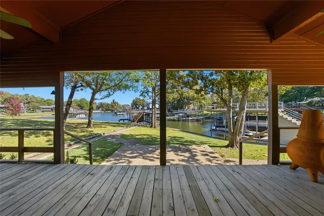 a view of a deck with wooden floor and outdoor space