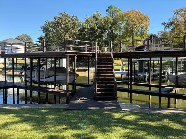 a swimming pool with view of trees in the background
