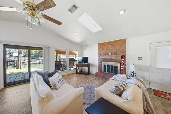 a living room with furniture fireplace and flat screen tv