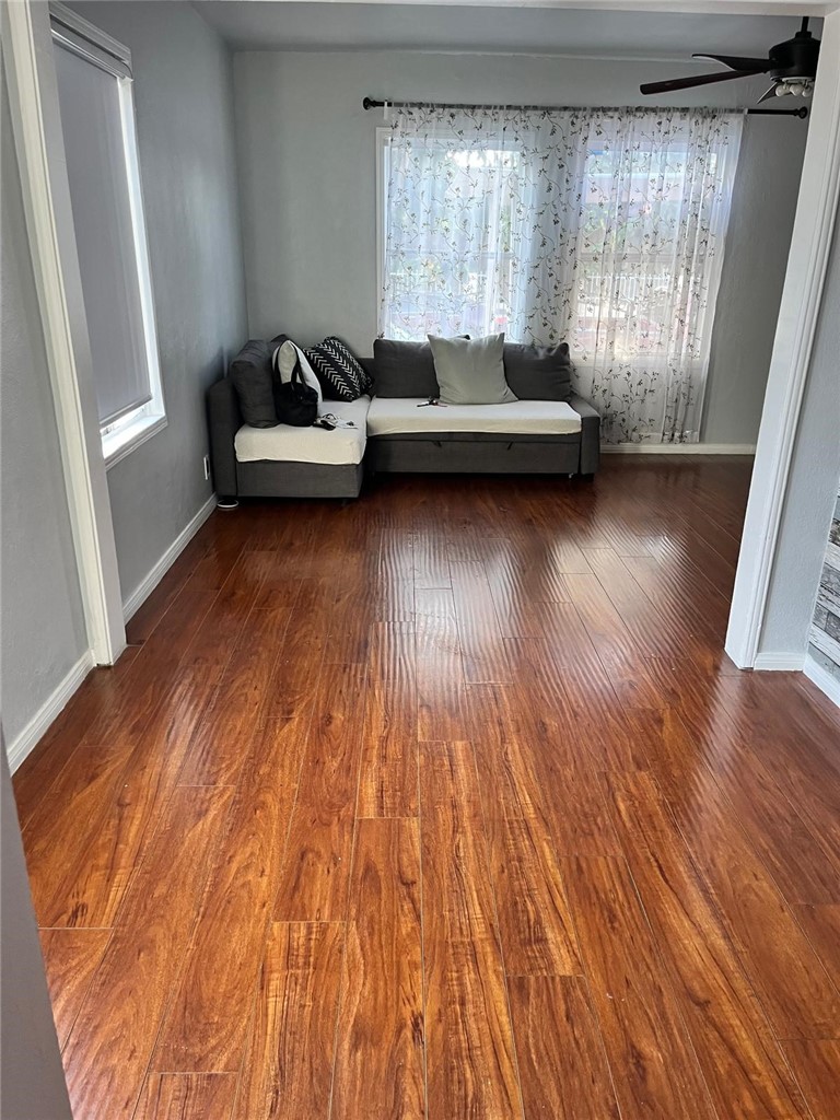 2102 East Lucien Street Compton, CA 90222 - Photo 4 of 10 a living room with furniture and a wooden floor