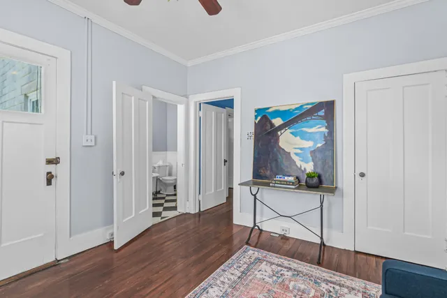 a view of room with wooden floor and cabinet