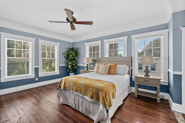 a bedroom with a large bed and a large window