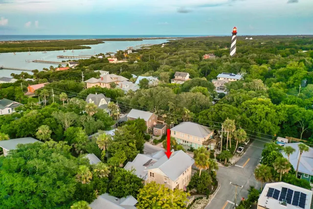 an aerial view of house with yard swimming pool and outdoor seating