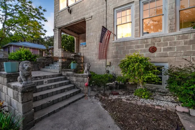 a view of a house with a yard porch and sitting area