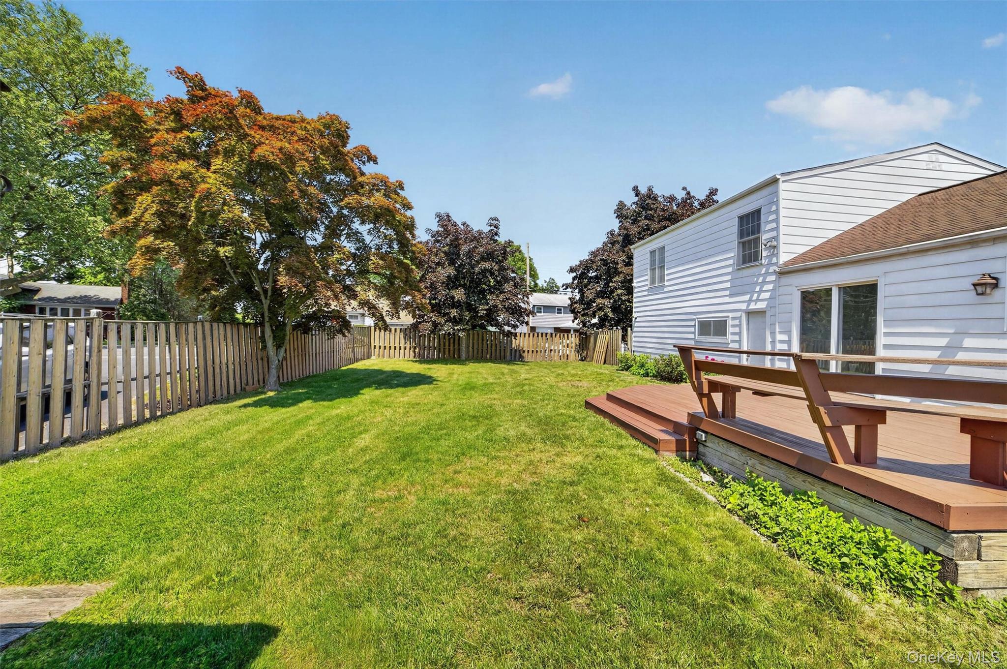 263 Croydon Road Yonkers, NY 10710 - Photo 38 of 43 a view of a backyard with a garden and deck