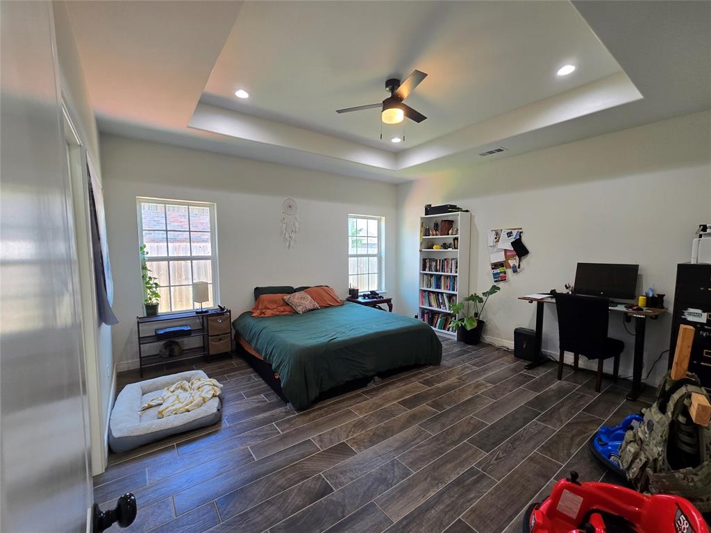 109 Baker Street Mount Vernon, TX 75457 - Photo 10 of 23 a bedroom with furniture and a window