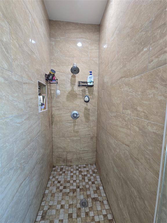 109 Baker Street Mount Vernon, TX 75457 - Photo 13 of 23 a bathroom with a shower