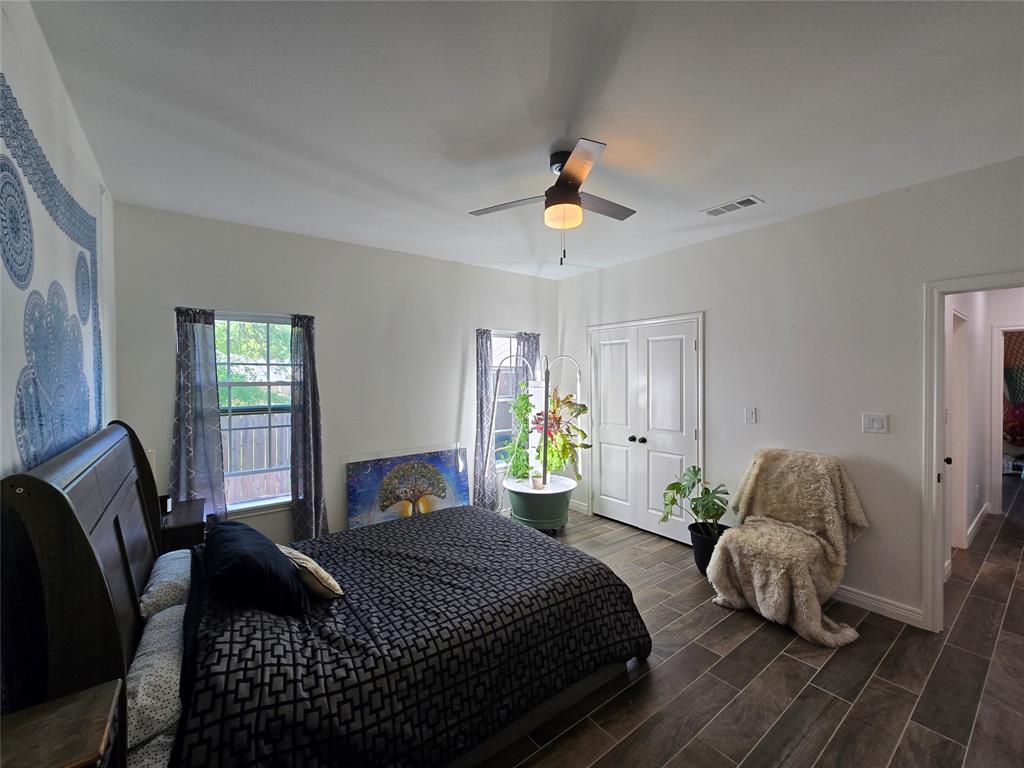 109 Baker Street Mount Vernon, TX 75457 - Photo 15 of 23 a bedroom with a bed couches chair and a window