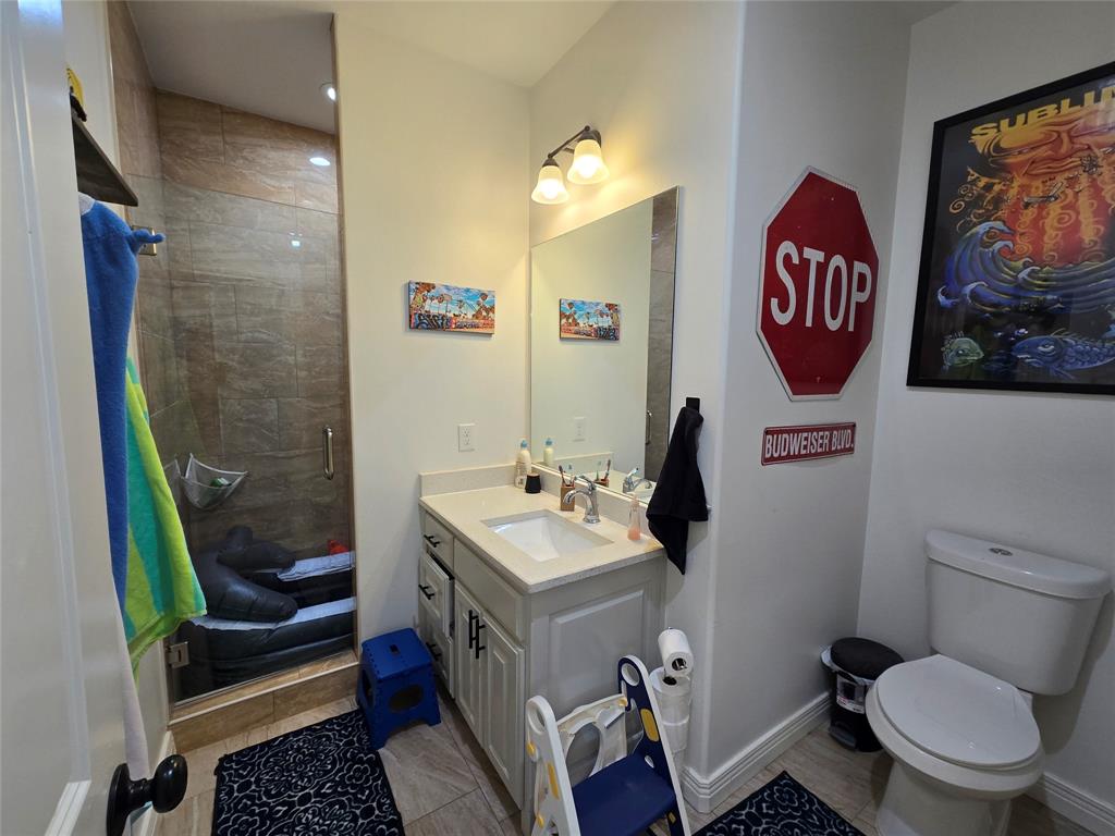 109 Baker Street Mount Vernon, TX 75457 - Photo 20 of 23 a bathroom with a sink toilet and shower