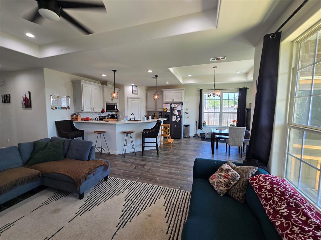 109 Baker Street Mount Vernon, TX 75457 - Photo 5 of 23 a living room with furniture and a large window