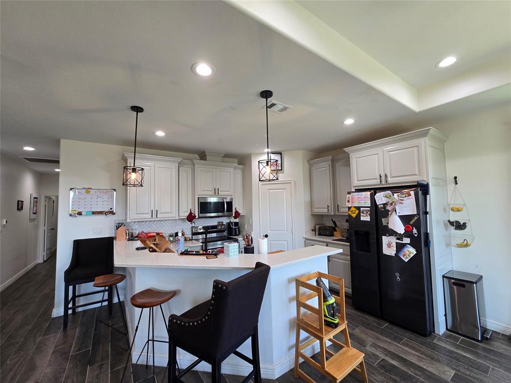 109 Baker Street Mount Vernon, TX 75457 - Photo 8 of 23 a kitchen view of counter top space and appliances
