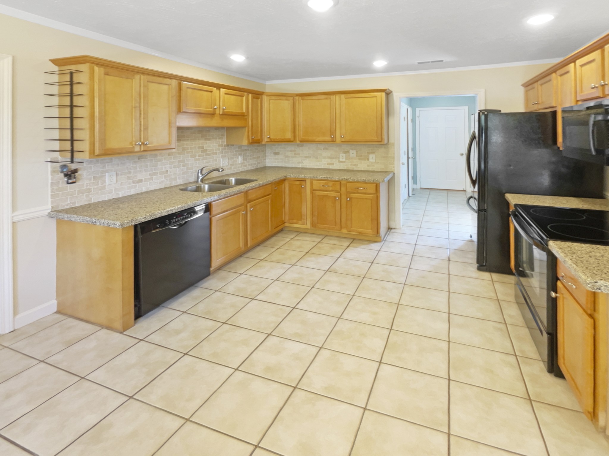 802 Riata Court Smyrna, TN 37167 - Photo 4 of 16 a kitchen with stainless steel appliances granite countertop a sink and cabinets