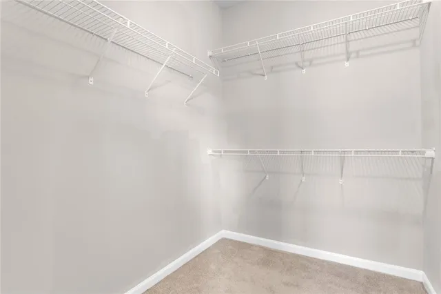 a view of a livingroom with a window and deck