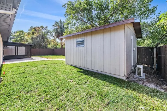 a backyard of a house with lots of green space