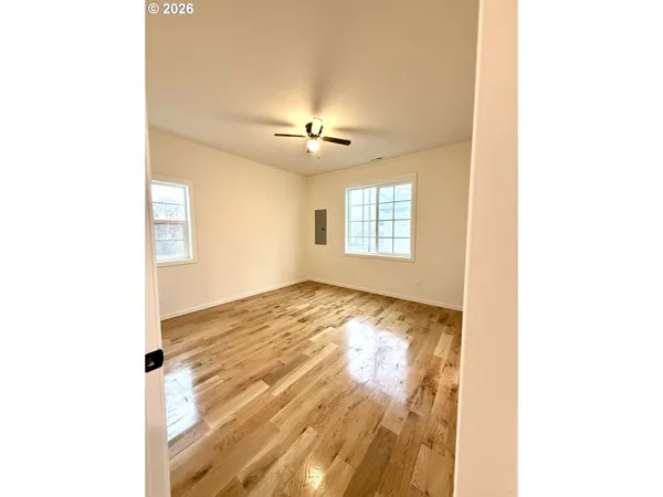 a view of an empty room with windows