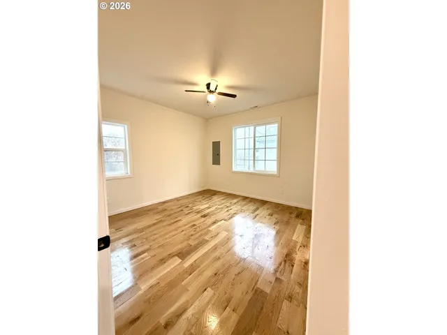 a view of an empty room with windows