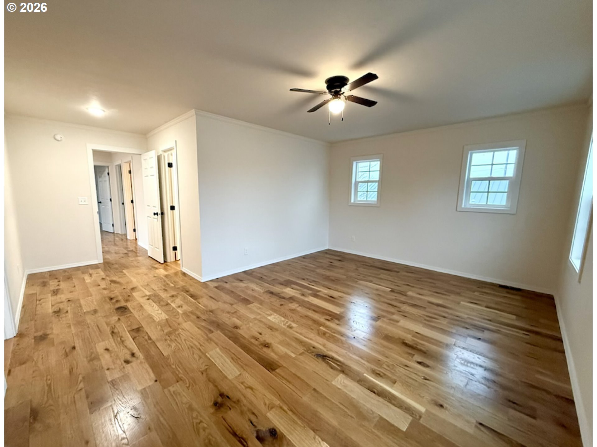 230 E Street North Powder, OR 97867 - Photo 15 of 34 a view of empty room with wooden floor and fan