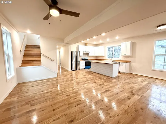 a view of a kitchen with a sink and cabinets