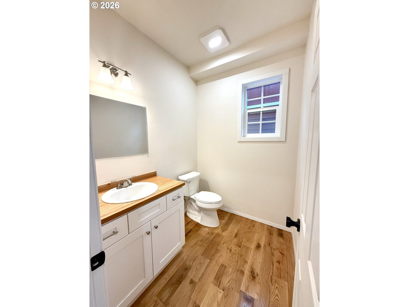 230 E Street North Powder, OR 97867 - Photo 9 of 34 a spacious bathroom with a toilet sink and a mirror
