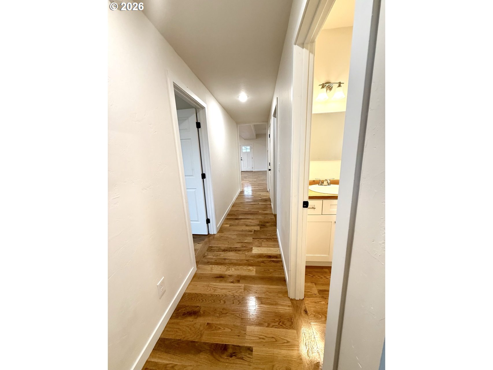 230 E Street North Powder, OR 97867 - Photo 10 of 34 a view of a hallway with wooden floor
