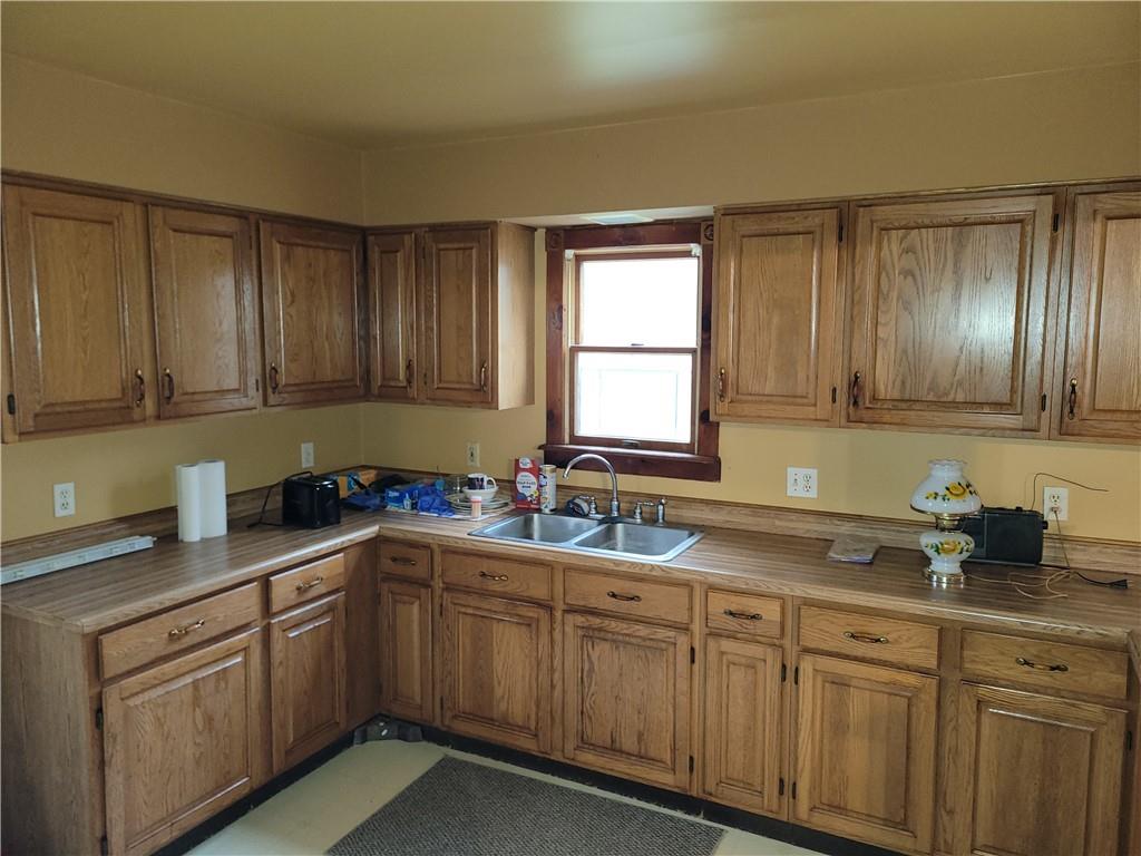 116 Willadell Road Transfer, PA 16154 - Photo 8 of 23 a kitchen with sink a window and cabinets